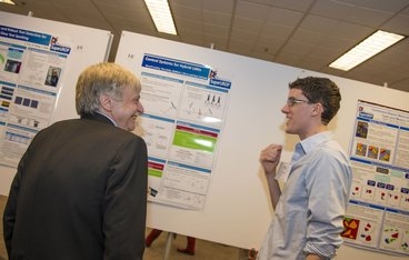 Dennis Freeman, MIT dean for undergraduate education and instructor for a SuperUROP class, talks with Benoit Landry, '14, about his work developing advanced agility for unmanned aerial vehicles, supported by the automotive technology company DENSO.
