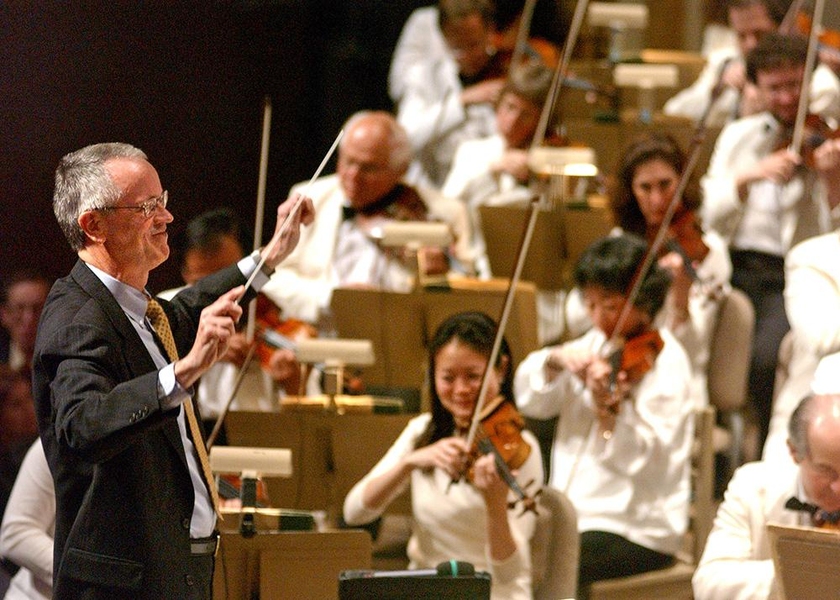 Former MIT President Charles M. Vest serves as a guest conductor for the Boston Pops.
