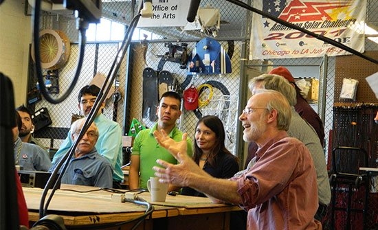 Ed Moriarty (right) moderates the conversation.