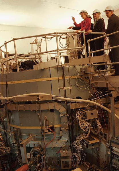 (From left) Warren, White, and Rep. Jay Livingstone atop the Alcator C-Mod tokamak.