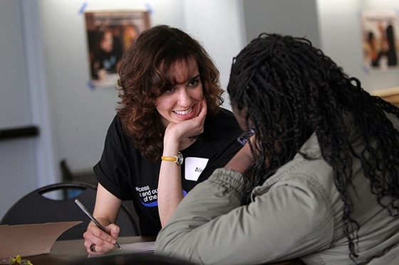 Dincer talking with a student during an Amphibious Achievement session.