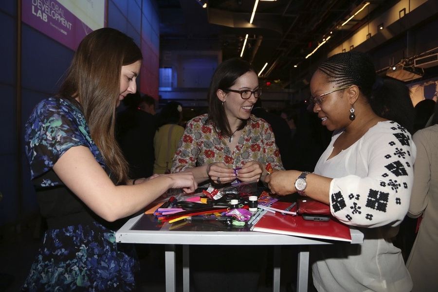Participants at the D-Lab Co-Creation Workshop devise their own inflatable lights using simple materials.

