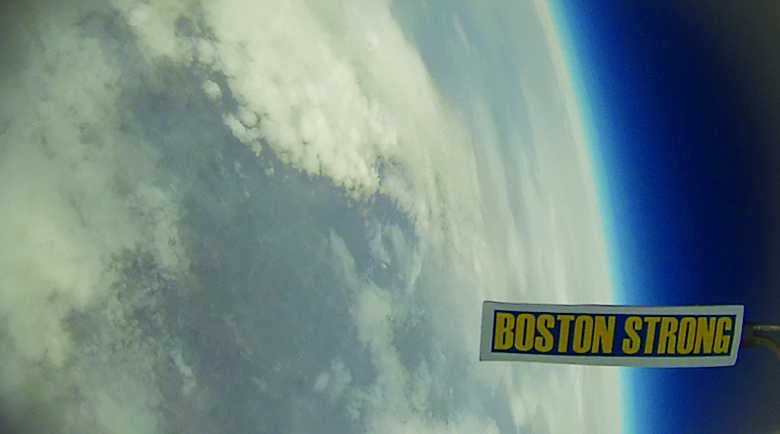 MIT's Global Space Balloon entry carried a "Boston Strong" banner to 80,000 feet. At this altitude, the Earth's curvature is plainly visible.