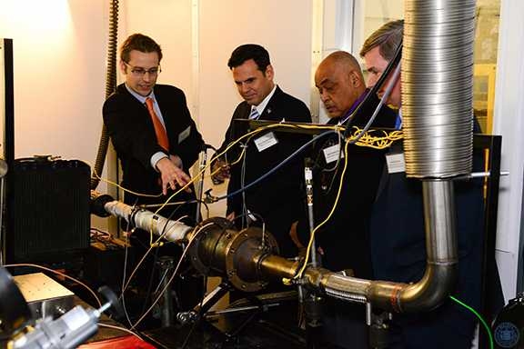 A demonstration of FST sensors installed on a diesel engine exhaust system. Pictured, from left: Alexander Sappok PhD ’09 (president, FST); Gary Christenson (mayor, City of Malden); Neal Anderson (president, Malden City Council); Greg Bialecki (Massachusetts State Secretary of Housing and Economic Development).