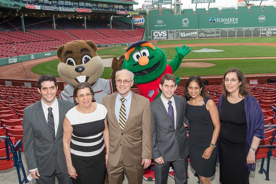 Don Rosenfield and his family pose at Fenway Park with two famous figures: MIT’s Tim the Beaver and Wally the Red Sox mascot. From left to right are: Don’s son, Adam; wife, Nancy; Don; son, Todd (LGO ’14), and Todd’s wife, Runa; and daughter, Jennifer.