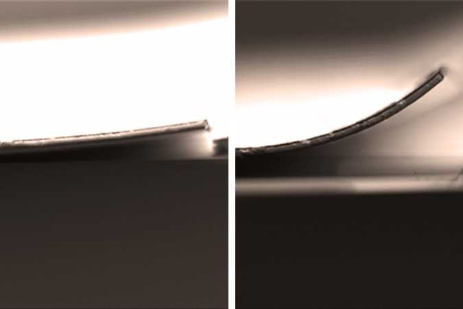To test the properties of bonded surfaces, researchers used layered materials (in this case a chromium layer bonded to a silica layer by a layer of epoxy), that were pulled apart, sliced in cross-section, and imaged with a scanning electron microscope. At left, a dry sample shows no debonding of the layers, but at right, a sample exposed to moisture for four weeks shows significant debonding.
