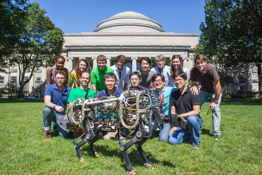 MIT Biomimetic Robotics Laboratory members pose with the MIT cheetah robot in Killian Court. (Top row, from left) Deborah Ajilo, Negin Abdolrahim Poorheravi,John Patrick Mayo,Justin Cheung, Sangbae Kim, Shinsuk Park, Kathryn L. Evans, and Matt Angle. (Bottom row, from left) Will Bosworth, Joao Luiz Almeida Souza Ramos, Sehyuk Yim, Albert Wang, Meng Yee Chuah, and Hae Won Park. 
