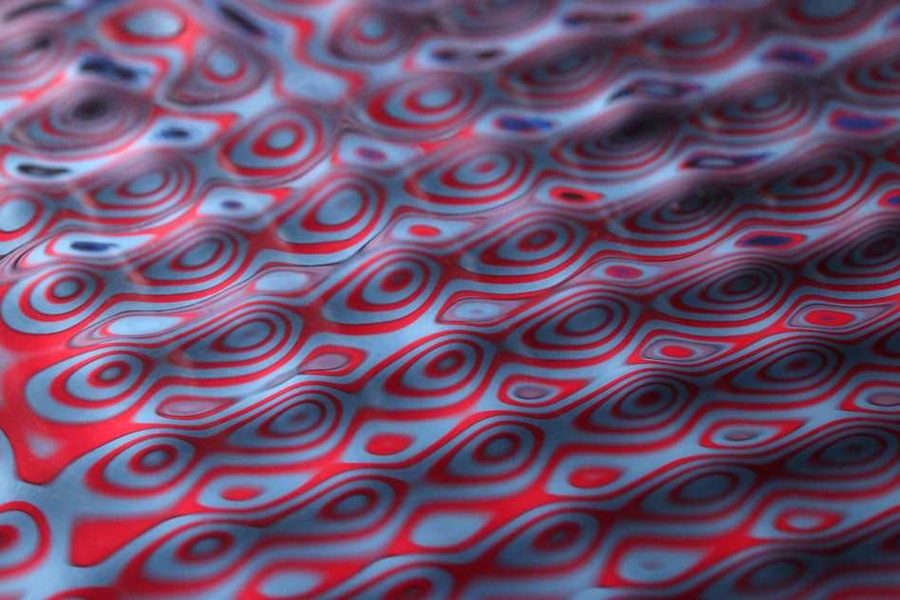 Close-ups of an experiment conducted by John Bush and his student Daniel Harris, in which a bouncing droplet of fluid was propelled across a fluid bath by waves it generated.