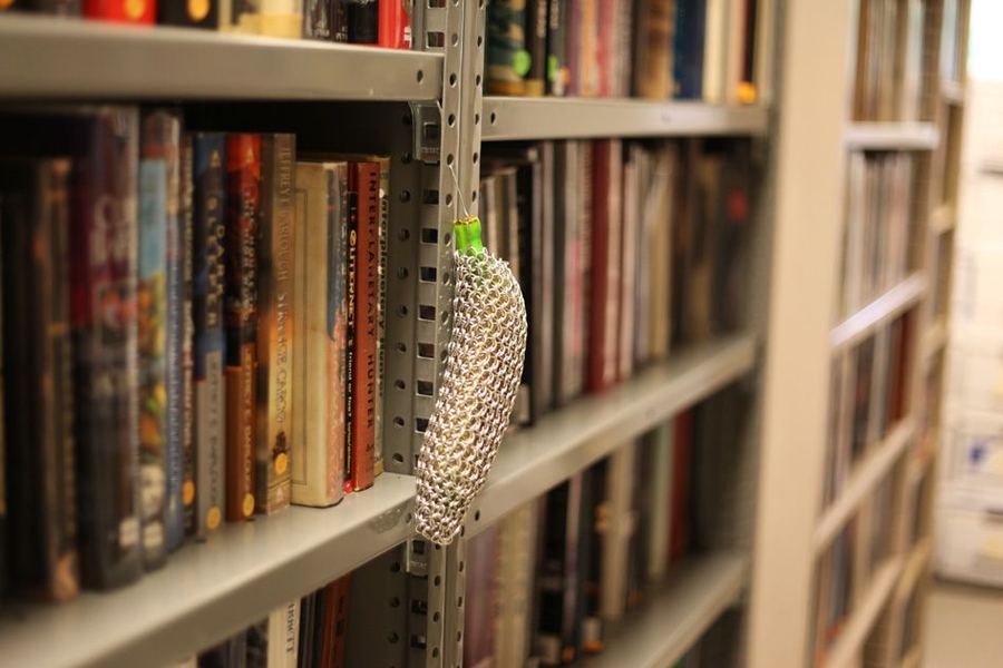 One of the library’s collection of bananas hangs from a shelf. The bananas are available for check out. “Be warned that we have a digital electronic checkout system, and if you return the banana late, it will fine you,” McKnight says. 
