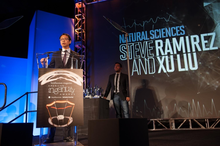 Xu Liu accepting the team's award