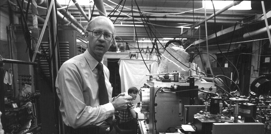 Professor James L. Kinsey, circa 1978, with graduate student Edmond Murphy in the background.