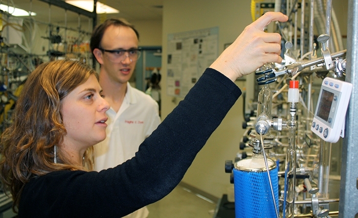 Chris Follett and collaborator Chiara Sanitelli, a visiting scientist from the Institute of Biophysics in Pisa, Italy, process deep ocean samples for radiocarbon measurements.