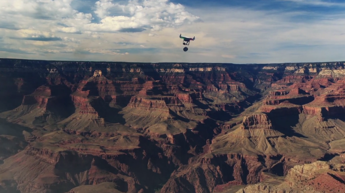 A screenshot from the Admissions Office's video shows a delivery drone flying over the Grand Canyon. 