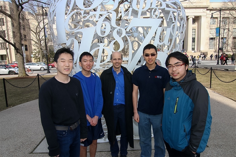 (Left to right) junior Mitchell Lee, sophomore Bobby Shen, mathematics professor Bjorn Poonen, freshman Mark Sellke, and sophomore Lingfu Zhang
