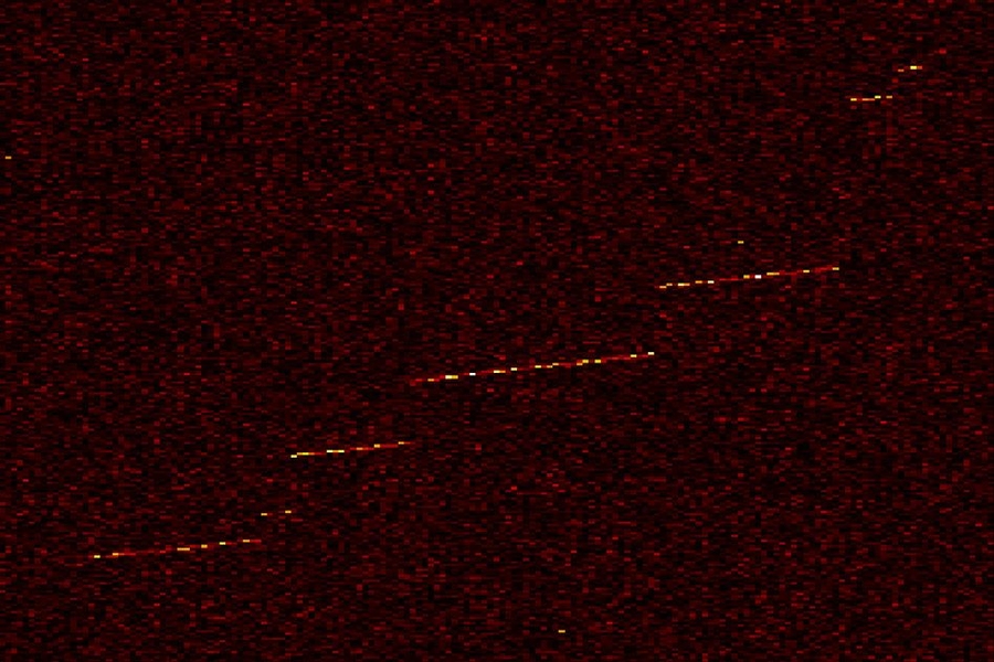 Shown here is "event zero," the first detection of a trapped electron in the MIT physicists' instrument. The color indicates the electron's detected power as a function of frequency and time. The sudden “jumps” in frequency indicate an electron collision with the residual hydrogen gas in the cell.