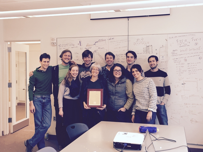 Professor Nancy Kanwisher and lab members celebrate her award.