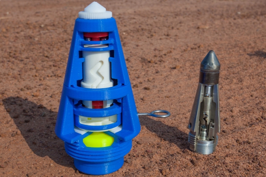 A 3-D-printed device (left) next to an actual explosive device