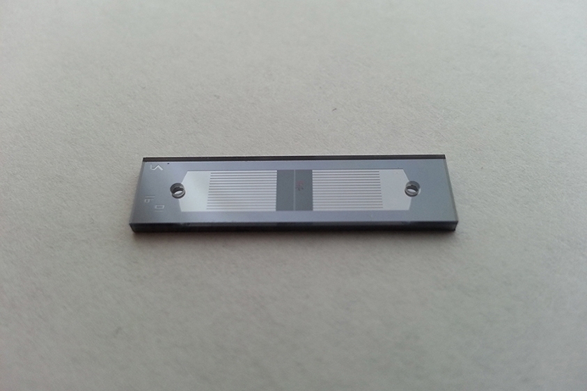 CellSqueeze’s microfluidic channels are etched on silicon chips and sealed with a glass layer. The channels temporarily deform cells so molecules can enter.
