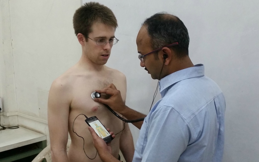 Daniel Chamberlain is examined by a doctor using the low-cost mobile platform to diagnose pulmonary disease that he and Rich Fletcher developed. The device recently won them a $100,000 Vodafone Wireless Innovation Project award.
