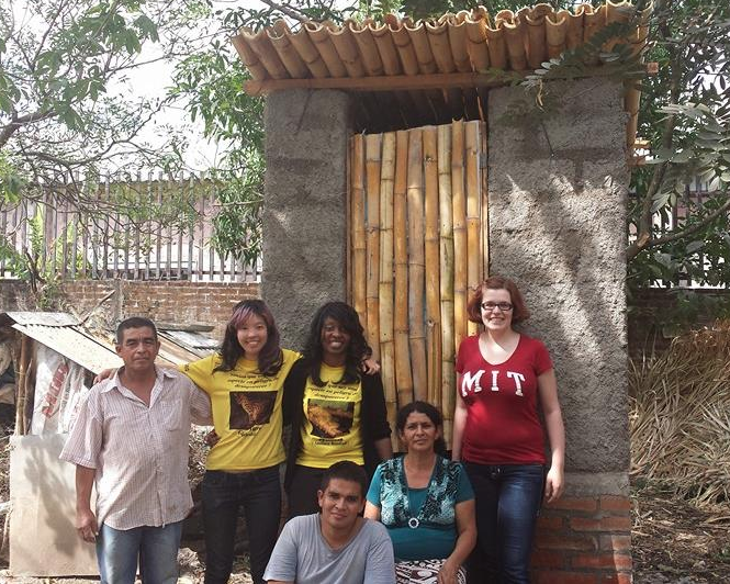 Elaine Kung '15 (second from left) and D-Lab instructor Libby Hsu (far right) with other members of the MIT and Salvadoran team in front of a newly completed compost toilet. In August, with support from MIT Tau Beta Pi, Kung will continue work she began with a D-Lab team on the redesign of a compost toilet for the Salvadoran rural health organization ASAPROSAR.