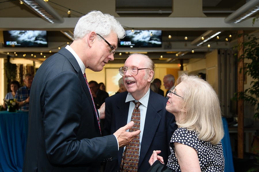 Department of Earth, Atmospheric and Planetary Sciences head Robert van der Hilst (left) converses with Peter Stone and Paola (Stone) Rizzoli.