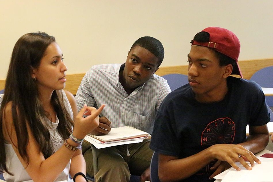 Members of the Geometers team (from left) Tiffany Bauman, Evan Fenton and Trajan Hammonds, confer on a problem. 
