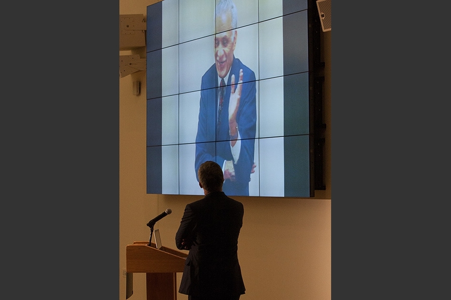 A projected image of the late Amar Bose, a longtime member of the MIT faculty and the founder of Bose Corporation