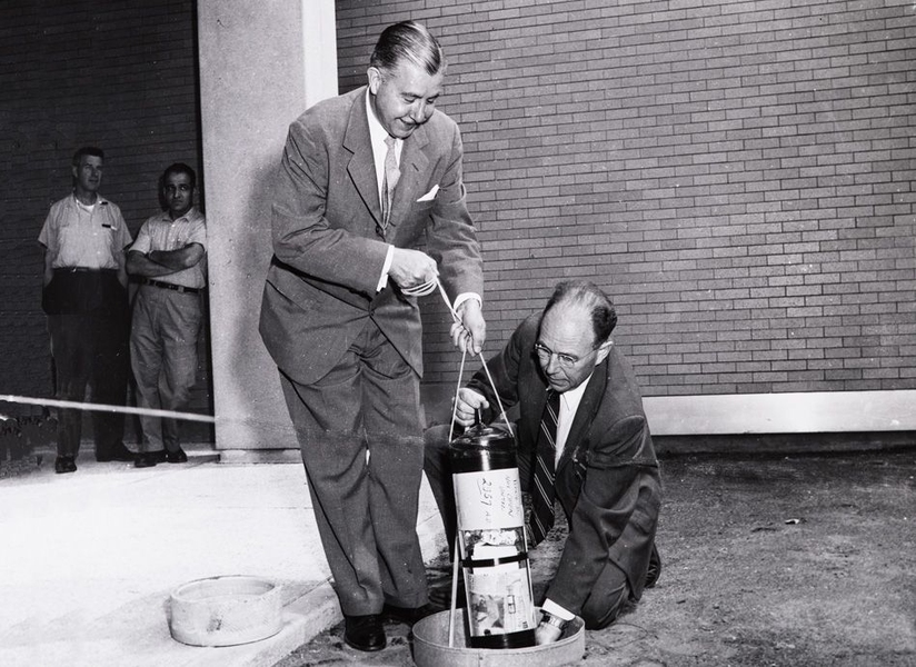 A 1957 photograph shows President James R. Killian Jr. (left) and professor of electrical engineering Harold “Doc” Edgerton burying the time capsule. 