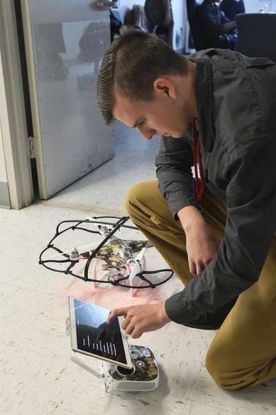 Sage Trudeau, a co-operative education student from Rensselaer Polytechnic Institute, works on programming drones for Lincoln Laboratory's Next Generation First Responder team.