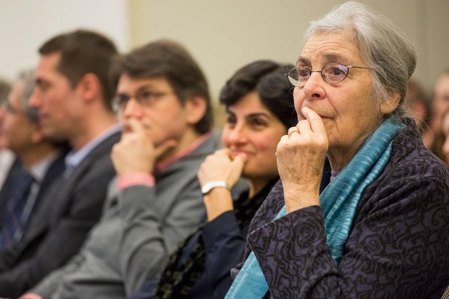 Rebecca Weiss, wife of Rainer Weiss, listens to the LIGO announcement webcast from the National Science Foundation in Washington, D. C.