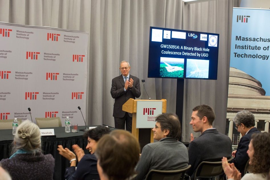MIT President L. Rafael Reif leads those gathered in the Bush Room in applauding Rebecca Weiss saying “…no doubt this has been your life’s work, too.”