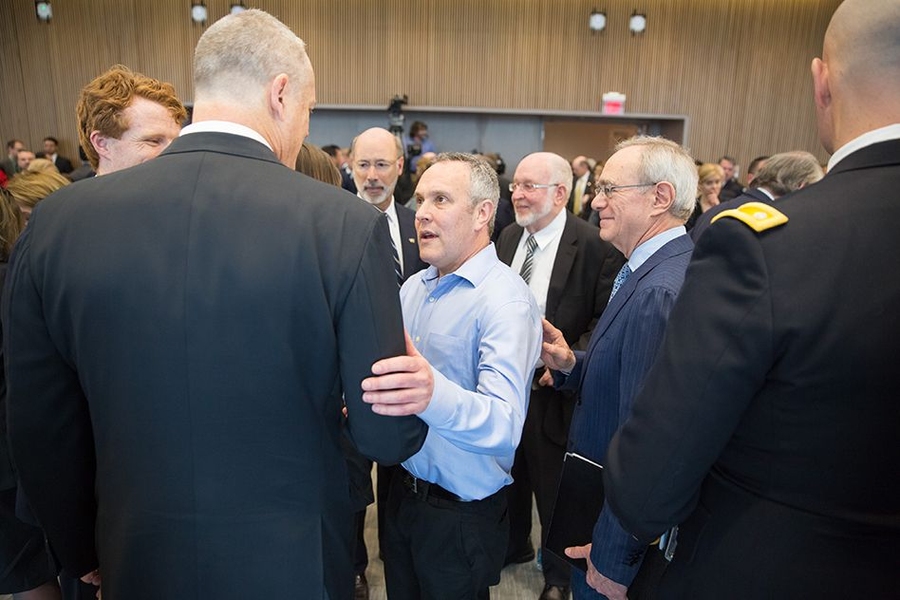 Professor Yoel Fink, director of MIT’s Research Laboratory of Electronics, speaks with Massachusetts Governor Charlie Baker.
