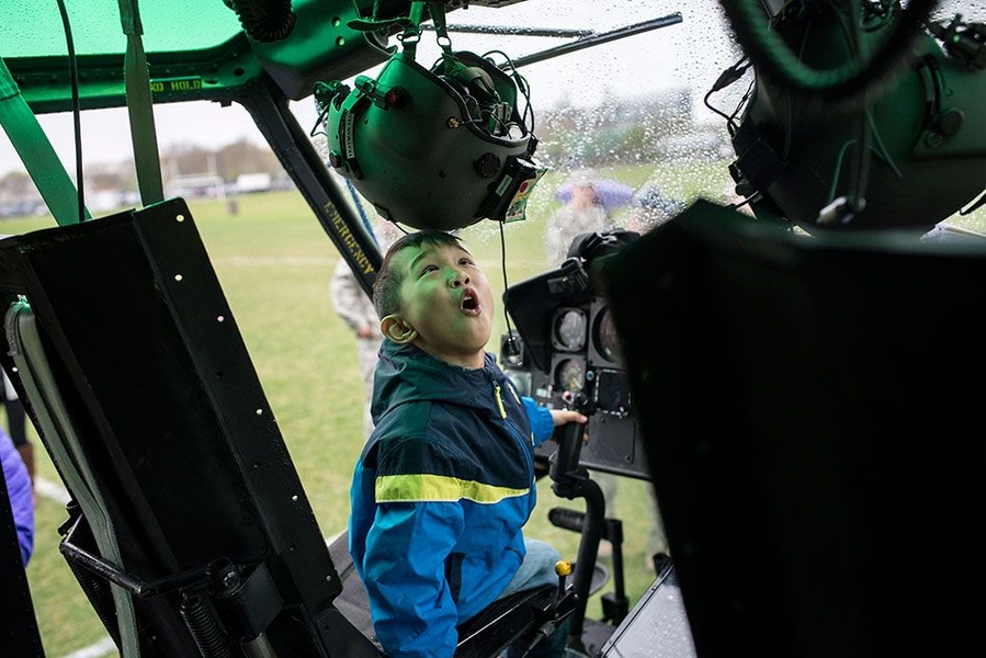 A helicopter on Briggs Field thrilled this young attendee. 