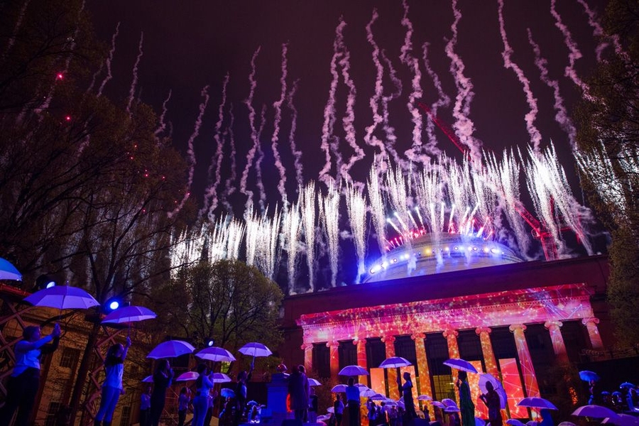 A troupe of dancing umbrellas appeared to ward off the rain as Killian Court lit up with fireworks and colorful computer-generated art. 
