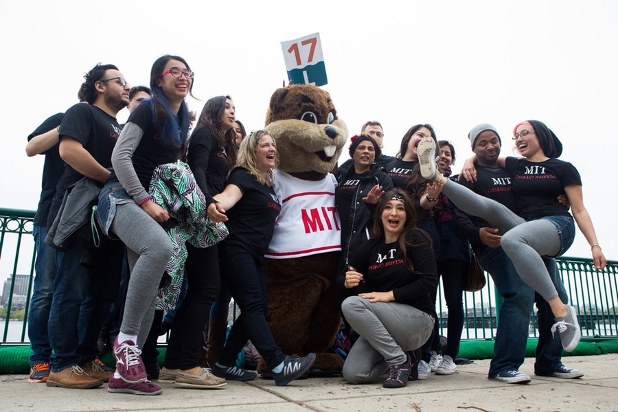 Students pose with MIT mascot “Tim the Beaver.” 
