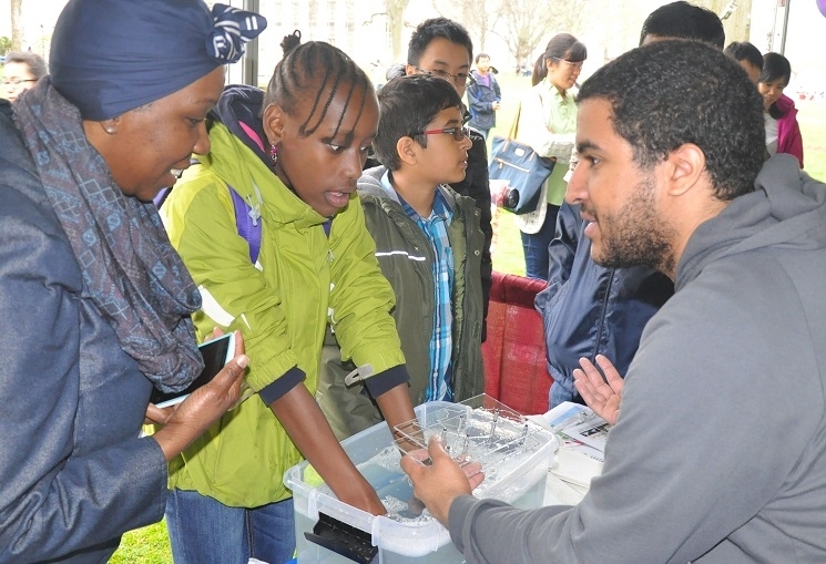 Grad students explained to visitors ways to use everyday household items like soapy water to identify solutions to structural design problems. 