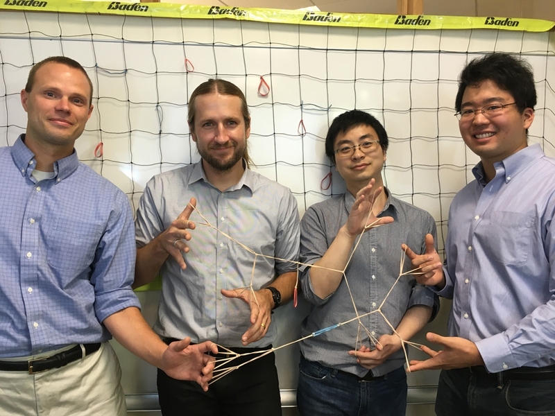 Left to right: Professors Bradley Olsen and Jeremiah Johnson, postdoc Rui Wang, and grad student Ken Kawamoto demonstrate polymer elasticity using rubber bands. 
