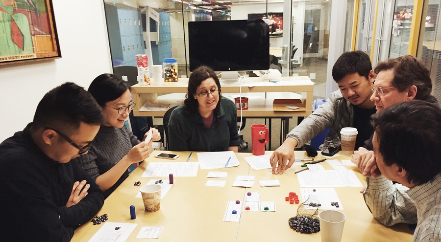 STL Lab and MIT Game Lab project participants work together to develop and test a socially responsible real estate game.