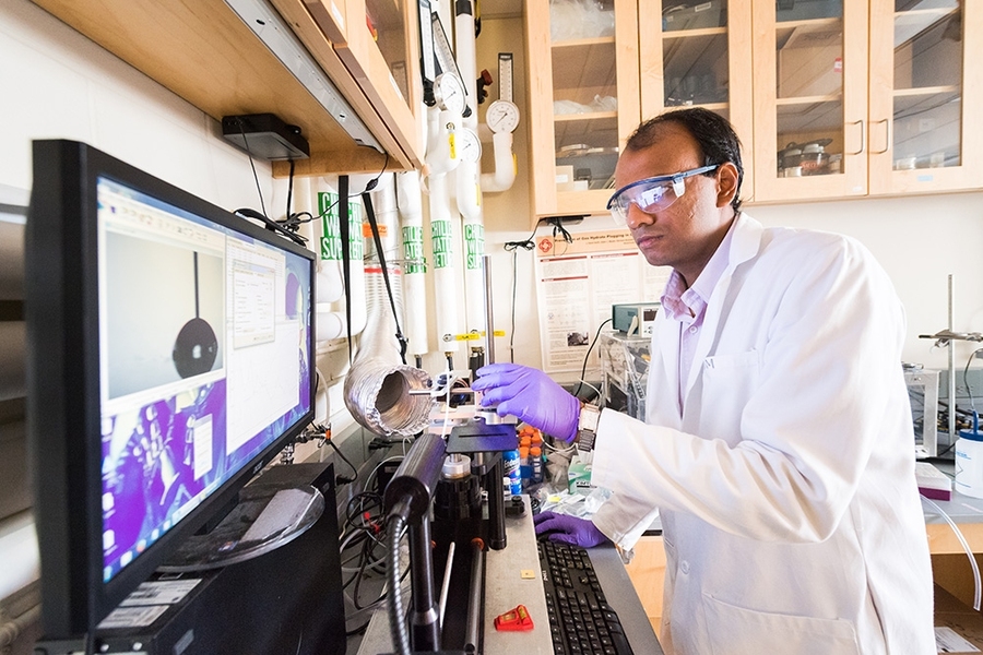 Srinivas Subramanyam, a graduate student in the MIT Department of Materials Science and Engineering, uses an instrument called a contact angle goniometer to measure interactions at the interface between one of his novel coatings and various types of fluids. Such measurements are critical for characterizing the new coatings and for testing their potential performance in icing and fouling environmen...