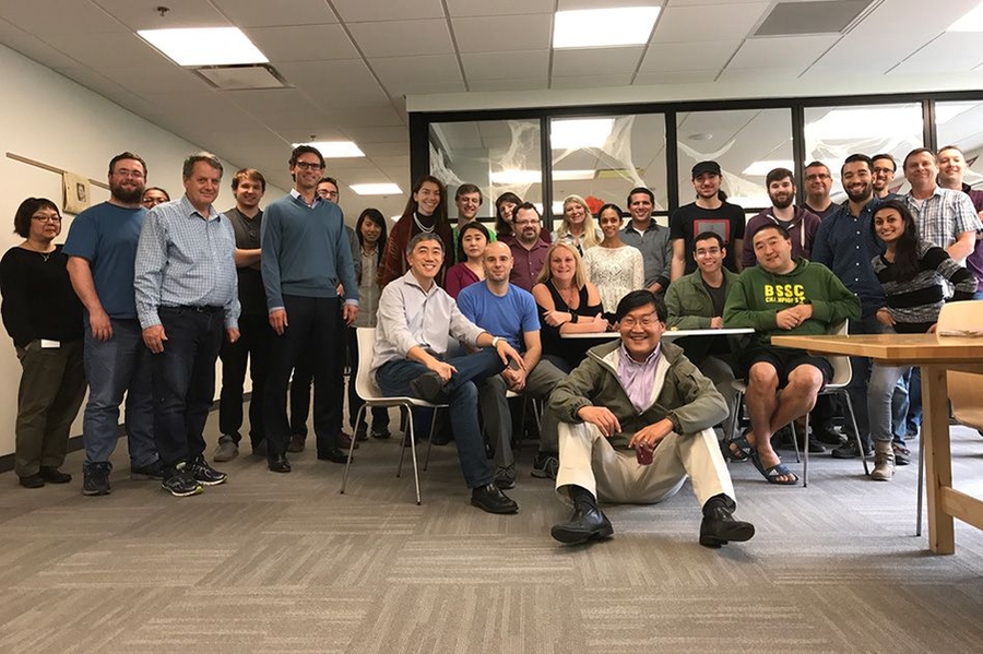 Caption: The Modo Labs team, including four members of the team that designed the original MIT mobile app: Andrew Yu (center, seated on floor), Brian Patt (blue shirt, seated), Eric Kim (white dress shirt, seated), and Sonya Huang (eighth from left, standing in back). 
