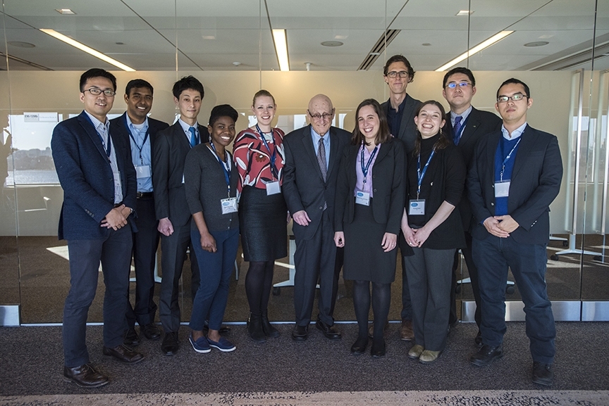 Professor Emeritus Joseph Sussman stands with members of his Regional Transportation Planning and High-Speed Rail Research Group at the 25th anniversary of the MIT-JR East partnership on March 2, where he was honored for his service. 