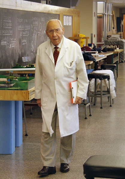 Professor Ernesto Blanco, in his signature white lab coat, at MIT’s Pappalardo Lab