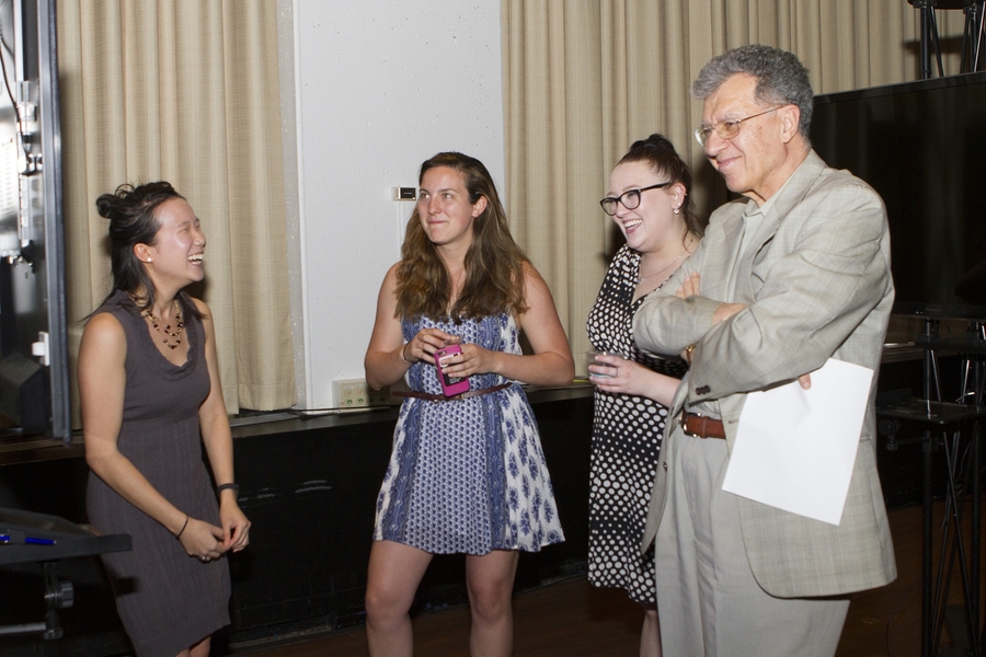 Senior Mary Hwang (left) presents her capstone research to graduate student Madison Noteware, staff member Sarah Smith, and Professor Oral Buyukozturk at the CEE Senior Celebration and Awards Ceremony. 