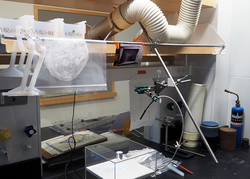 A single-crystal silicon with submicron features is displayed under LED light.