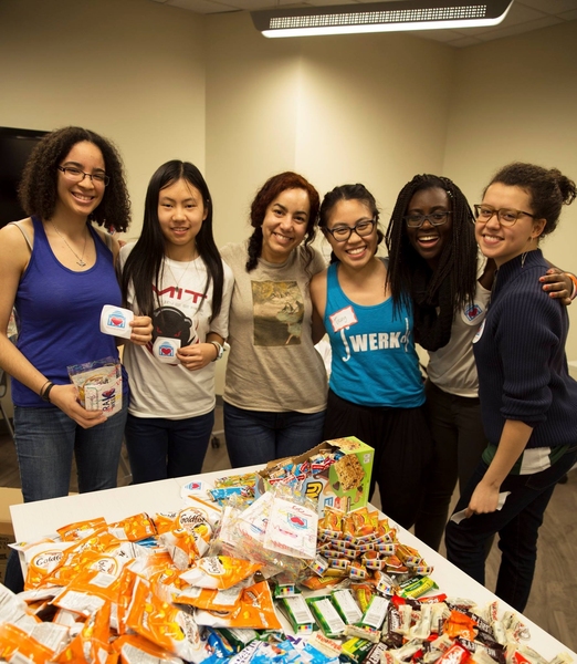 Bettina Arkhurst (second from right) and RAK Week volunteers prep care packages for their classmates.