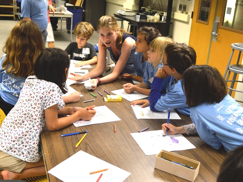 Graduate student Linda Seymour discussed her research into sustainable concrete mixtures with attendees of the 2017 CEE Kids Camp.