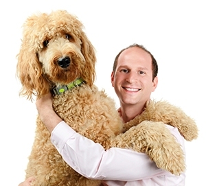 Flybrix founder and MIT alumnus Amir Hirsch gets some love from his Labradoodle, Freddie Mercury. “He’s definitely not a fan of drones,” says Hirsch. “He backs away and is a little bit afraid.”