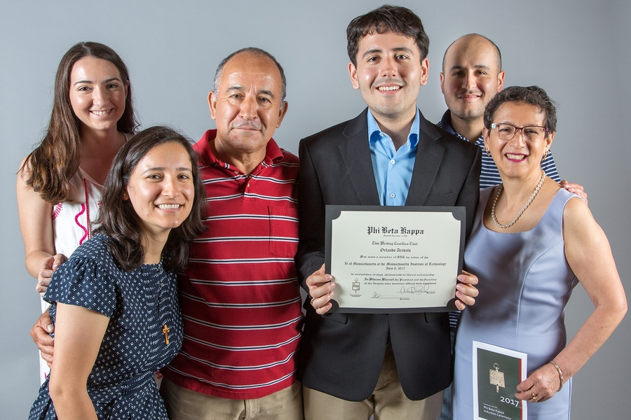Orlando Arvalo, a 2017 Phi Beta Kappa Society inductee, poses with his certificate and his proud family. 