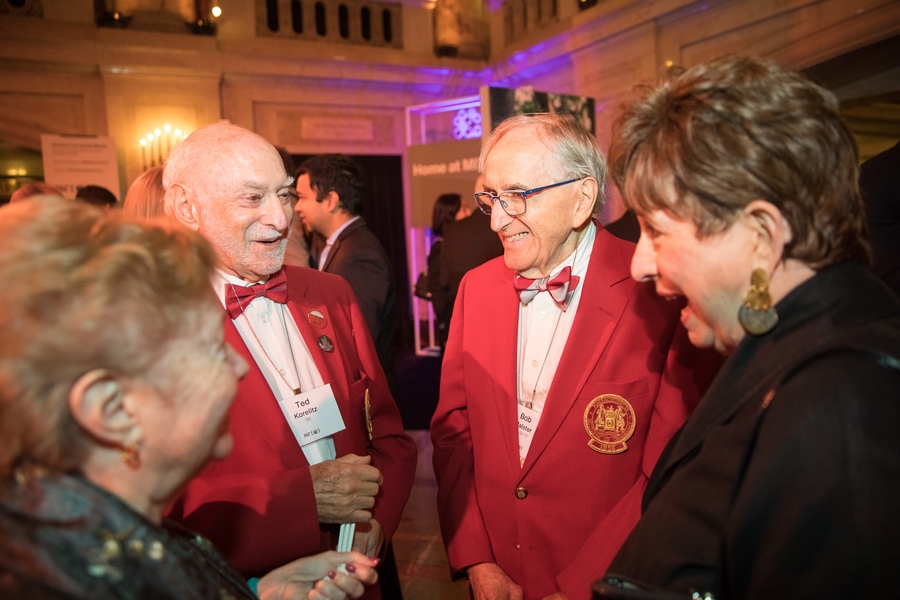 Guests mingle at a reception ahead of the program. 