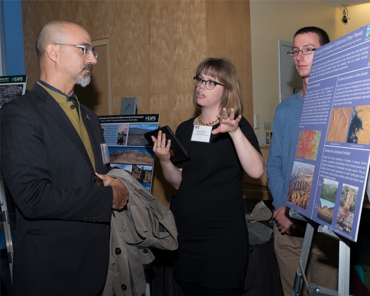 EAPS graduate student Marjorie Cantine explains her research to John Fernández, director of MIT’s Environmental Solutions Initiative. 